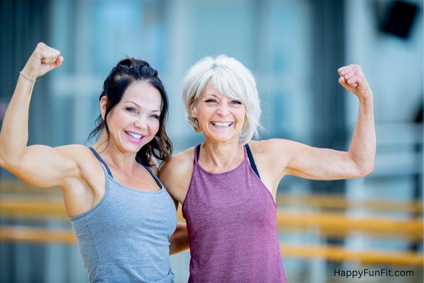 2 women flexing biceps